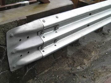 a galvanized type E terminal end used for thrie beam guardrails